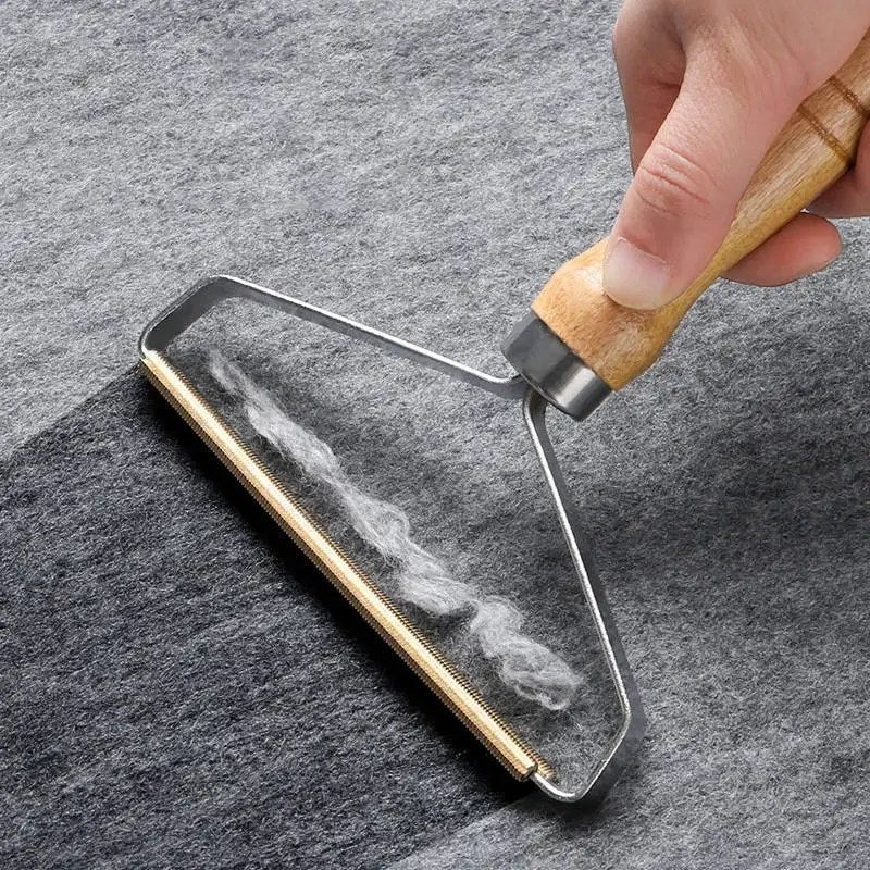 Portable lint remover brush cleaning pet hair and fabric fuzz